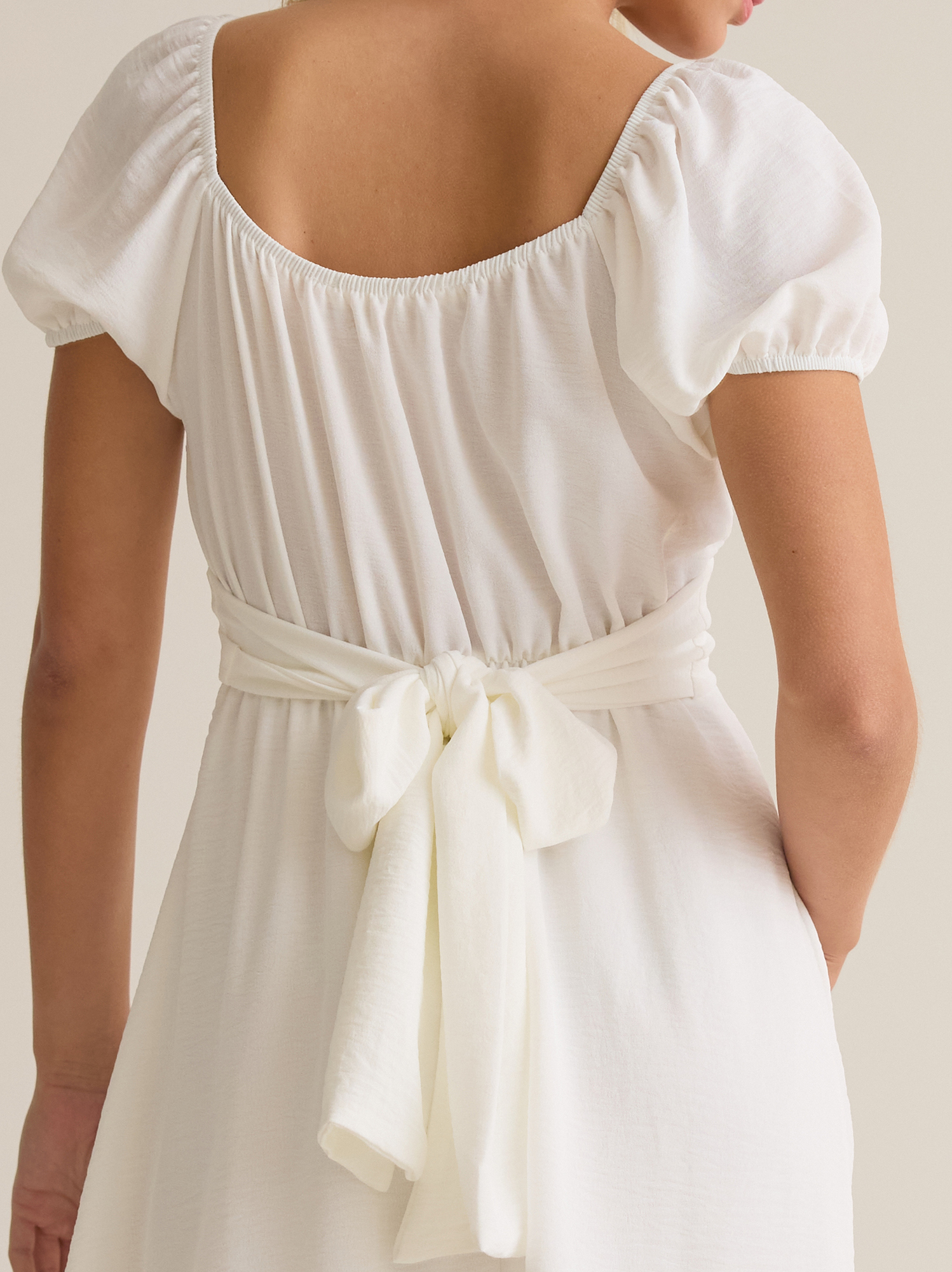 Delilah Crossover Mini Dress in White | Altar'd State