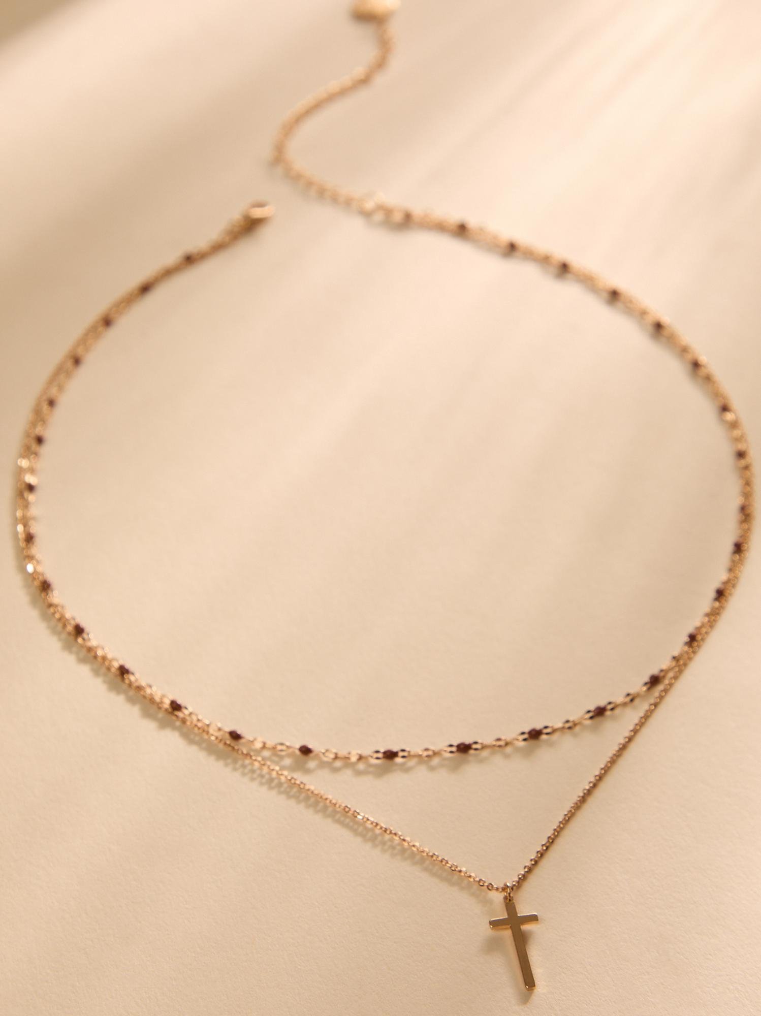 Jana Dot Charm Cross Necklace in Brown | Altar'd State