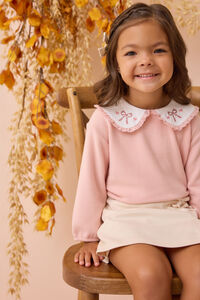 Colette Cross-Stitch Bow Sweater Detail 3 - Altar'd State