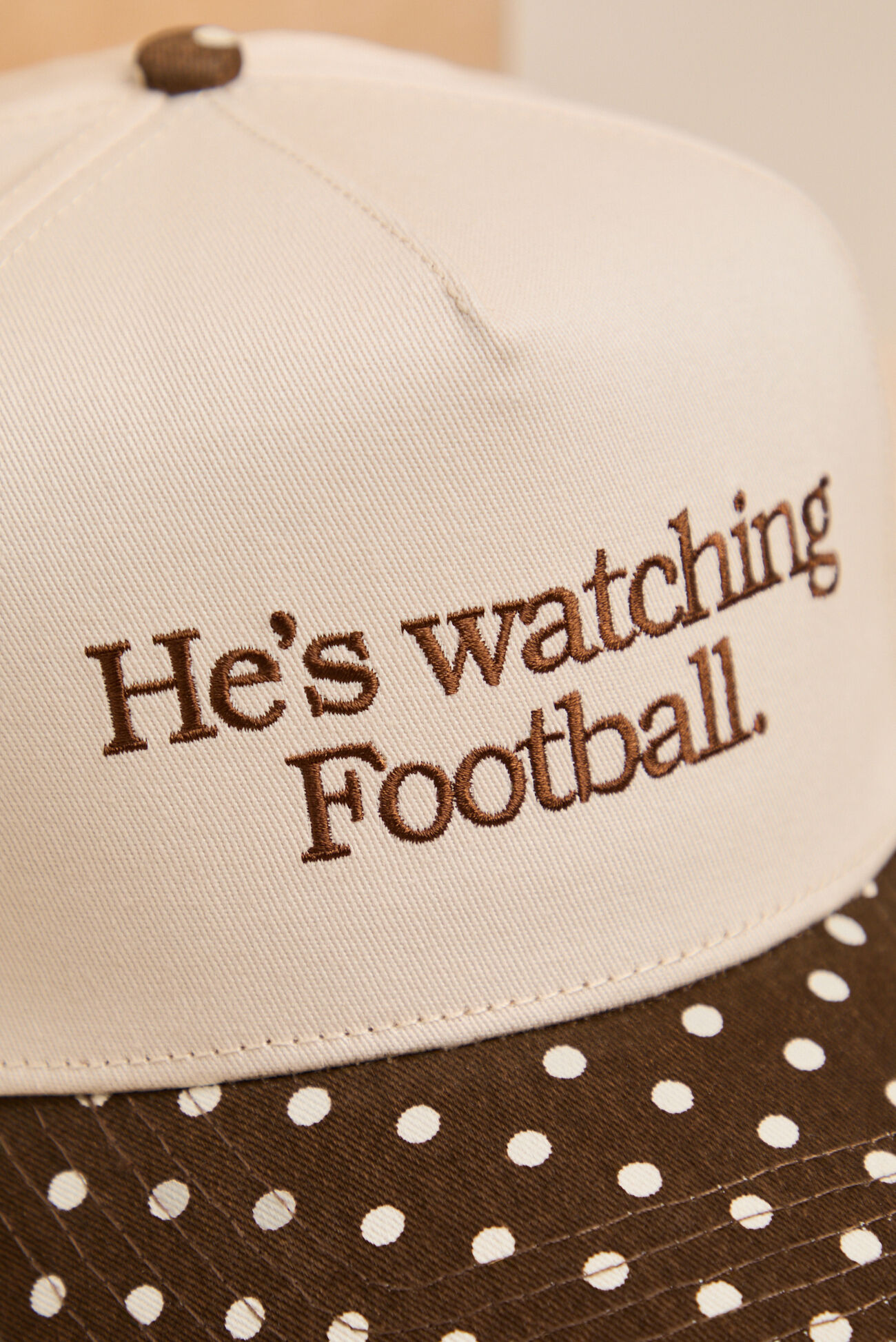 He's Watching Football Trucker Hat