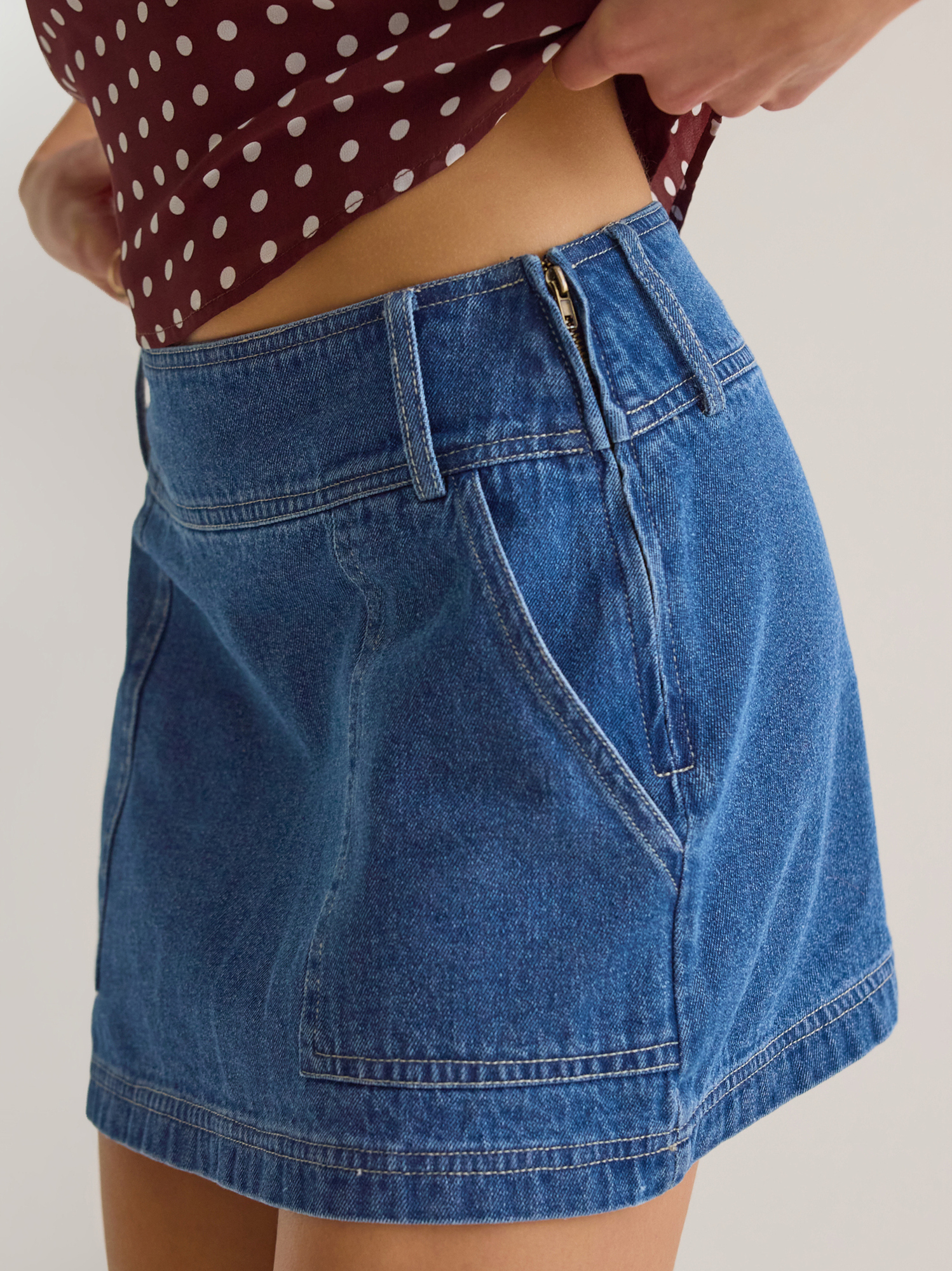 Karsen Denim Mini Skirt in Medium Wash | Altar'd State